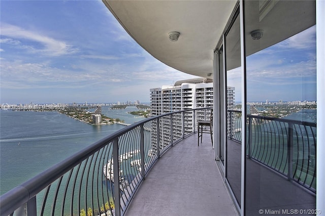 balcony featuring a water view