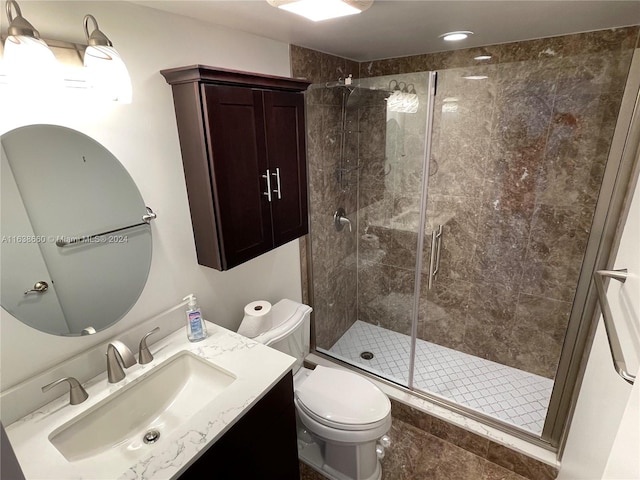 bathroom with a shower with door, toilet, tile patterned floors, and vanity