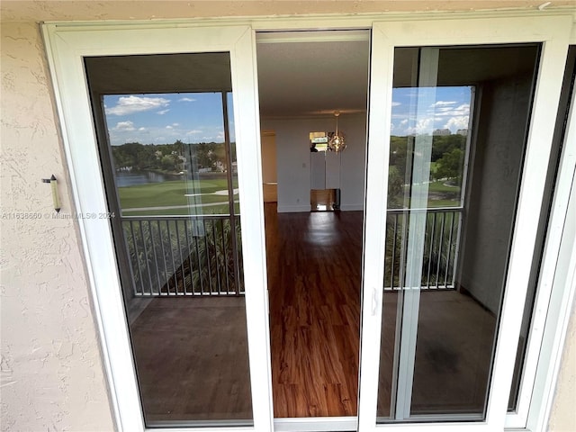 doorway to property featuring stucco siding