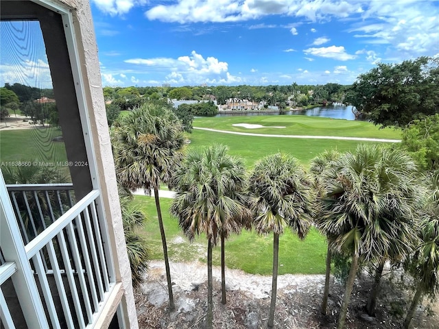 exterior space featuring view of golf course and a water view