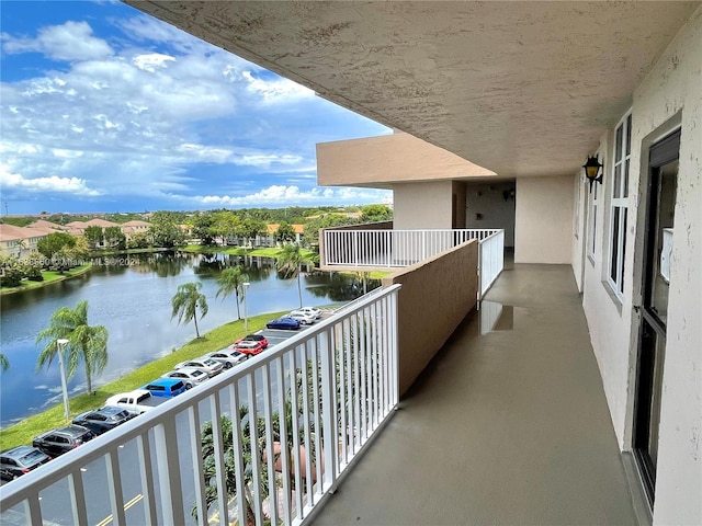 balcony featuring a water view