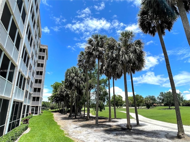 view of property's community featuring a yard