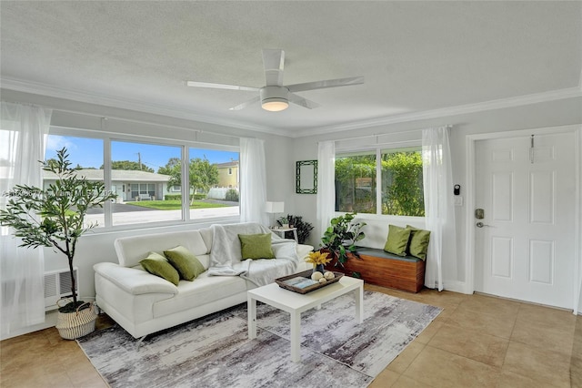 living room featuring light tile patterned floors, plenty of natural light, and crown molding