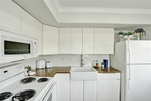 kitchen featuring crown molding, sink, white appliances, and white cabinets