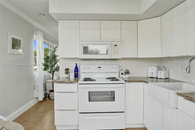 kitchen featuring tasteful backsplash, crown molding, white appliances, white cabinetry, and a sink