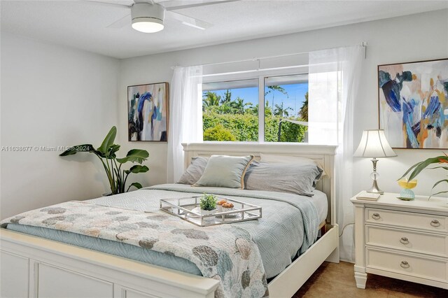 bedroom featuring ceiling fan and carpet floors