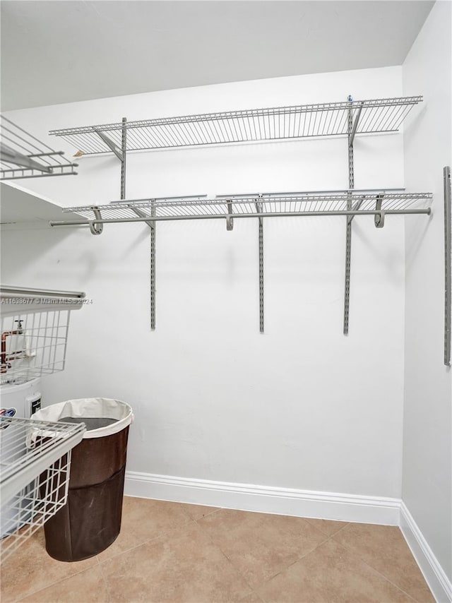 spacious closet featuring light tile patterned flooring