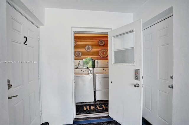 clothes washing area featuring separate washer and dryer