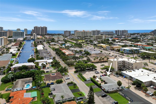 birds eye view of property featuring a view of city and a water view