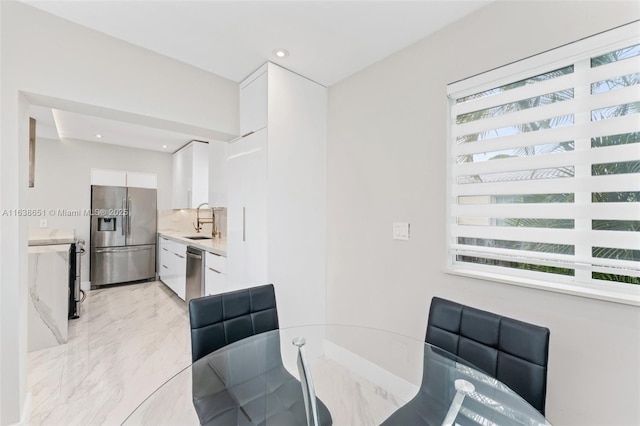 dining room with recessed lighting and marble finish floor