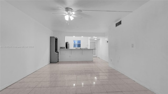 hallway featuring light tile patterned floors