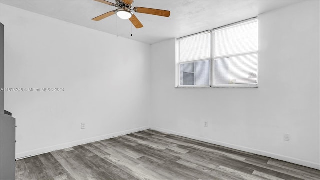 unfurnished room with ceiling fan and wood-type flooring