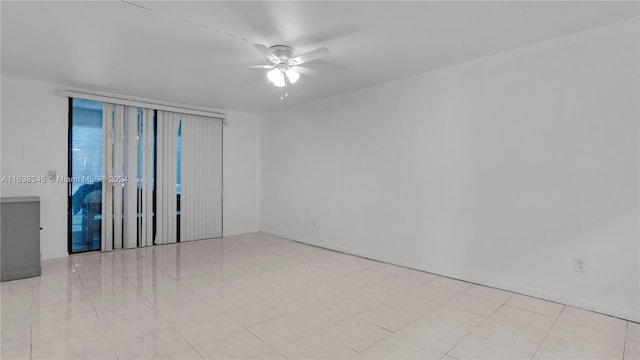 unfurnished room with light tile patterned floors and ceiling fan