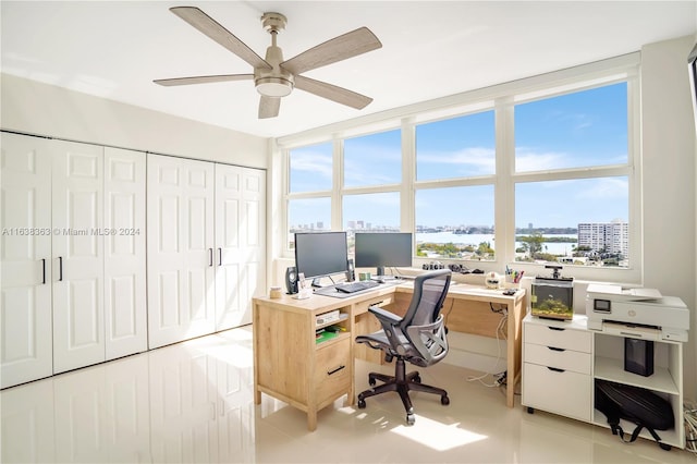 office area with ceiling fan, light tile patterned flooring, and floor to ceiling windows