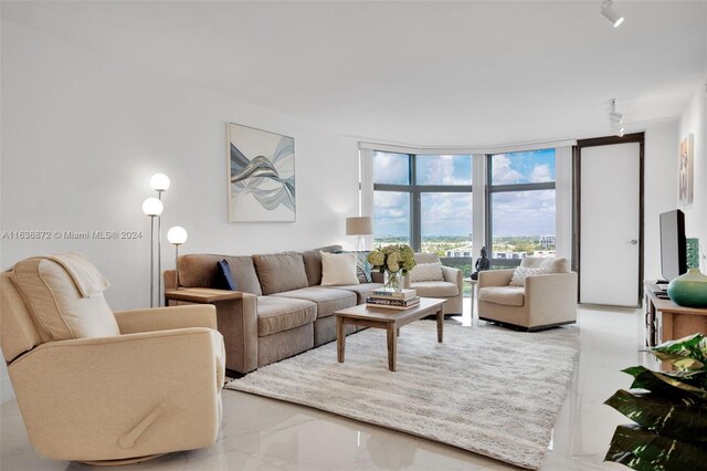 tiled living room with expansive windows