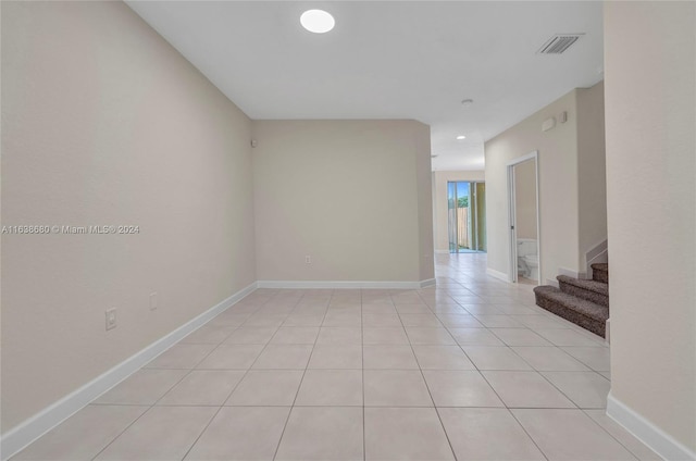 unfurnished room with light tile patterned floors