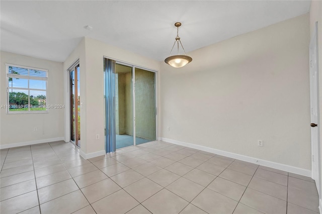 unfurnished bedroom with light tile patterned floors and a closet