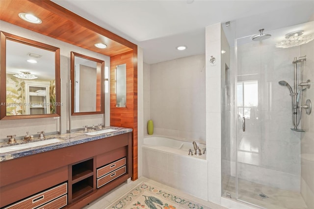 bathroom with double vanity, plus walk in shower, and tile patterned flooring