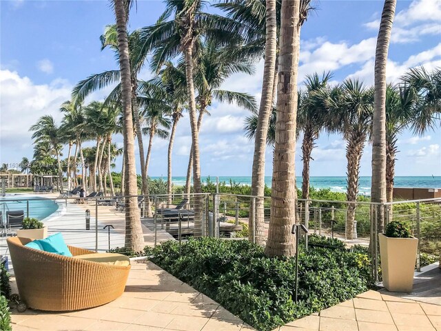 view of patio with a water view