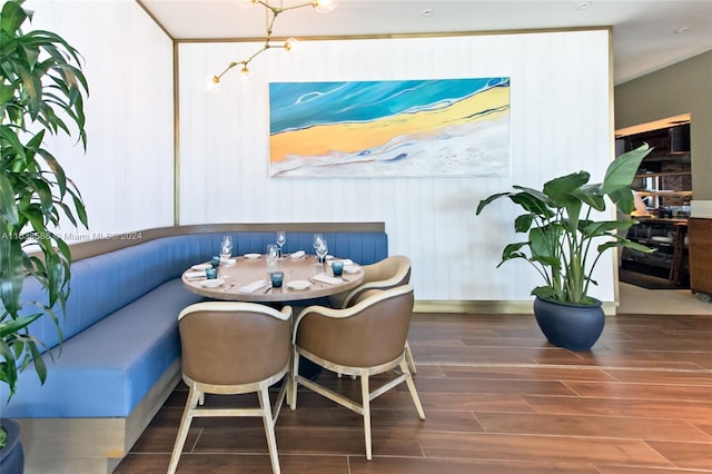 dining room featuring wood tiled floor and breakfast area