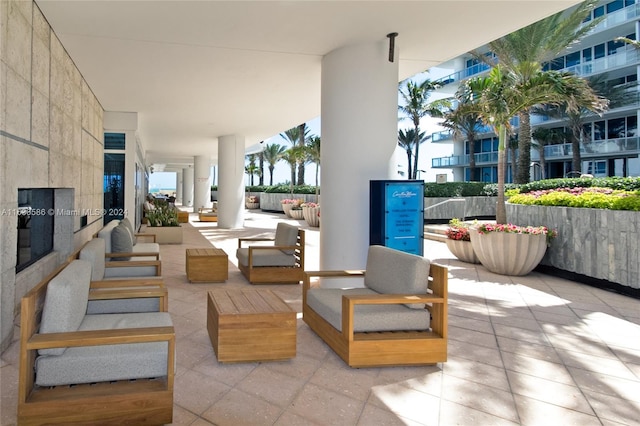 interior space featuring a balcony and outdoor lounge area