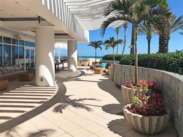 view of patio / terrace featuring a water view and a pergola