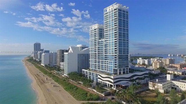 view of city with a water view and a beach view