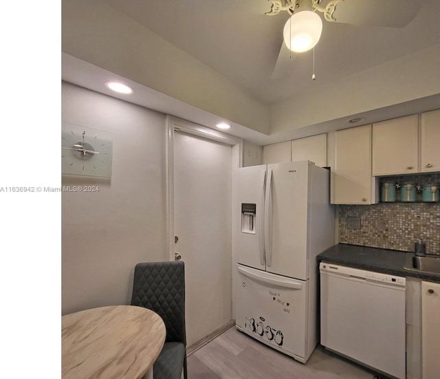 kitchen with ceiling fan, tasteful backsplash, white cabinetry, light hardwood / wood-style floors, and white appliances