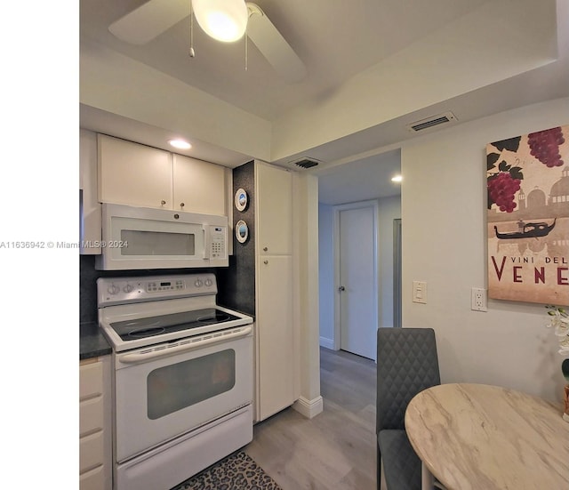 kitchen featuring white appliances, ceiling fan, white cabinetry, and light wood-type flooring