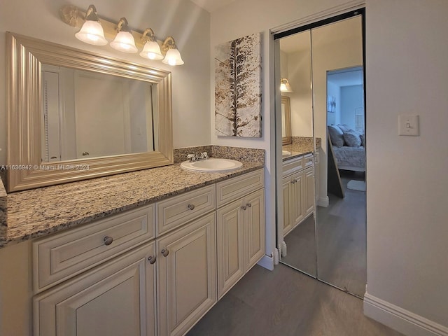 bathroom with wood-type flooring and vanity