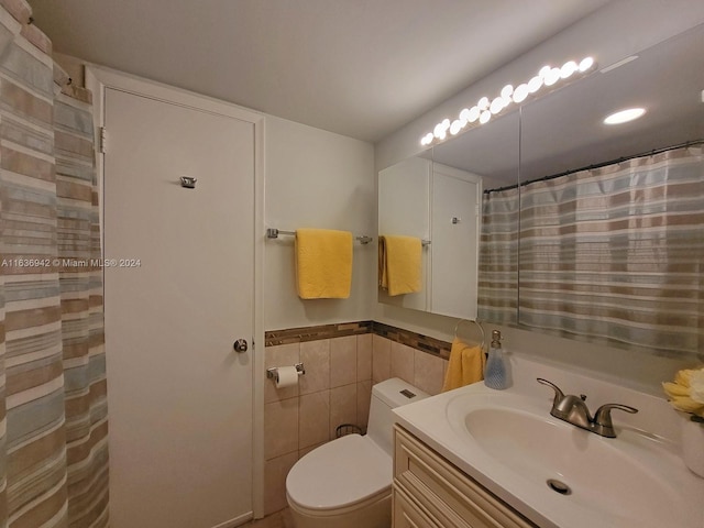 1825 S Ocean Dr Unit 206, Hallandale Beach, FL 33009 - full bath with vanity, tile walls, toilet, and a wainscoted wall