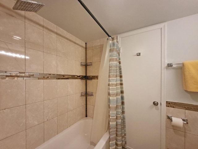 bathroom with shower / bathtub combination with curtain