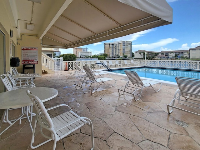 view of pool featuring a patio