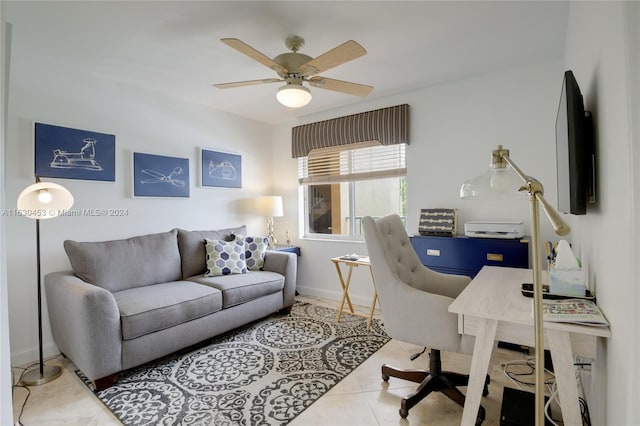 office area with ceiling fan and light tile patterned floors