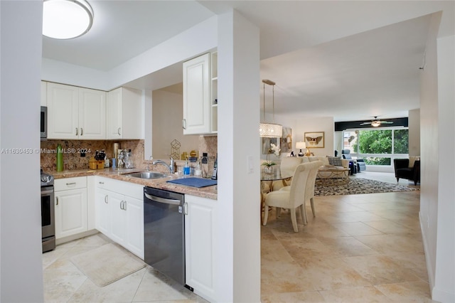 kitchen with ceiling fan, white cabinetry, sink, light tile patterned flooring, and stainless steel appliances