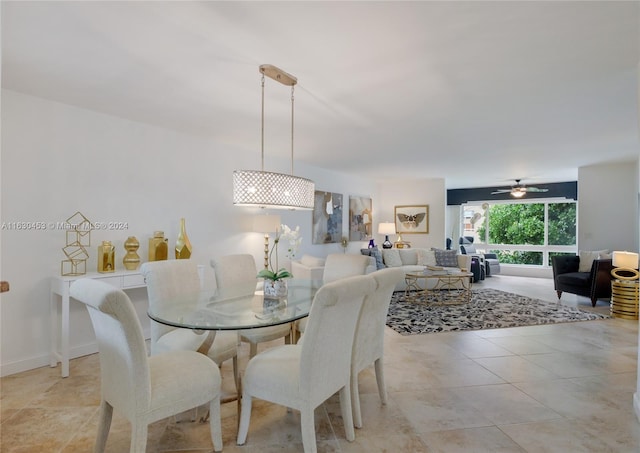 tiled dining space with ceiling fan