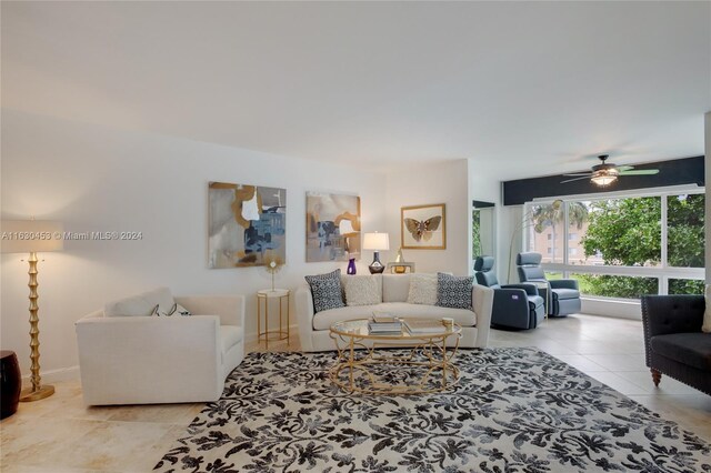 living room featuring ceiling fan and light tile patterned flooring