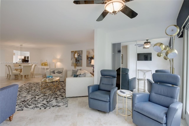 tiled living room featuring ceiling fan