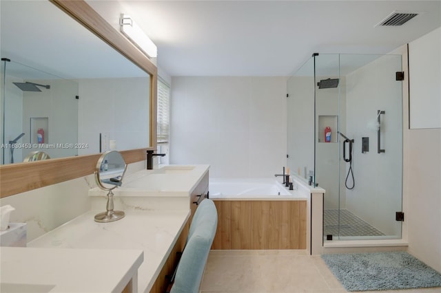 bathroom featuring tile patterned flooring, separate shower and tub, and double vanity