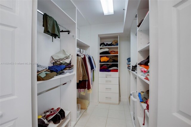 spacious closet featuring light tile patterned flooring