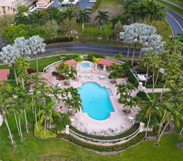 view of pool with a community hot tub and a patio area