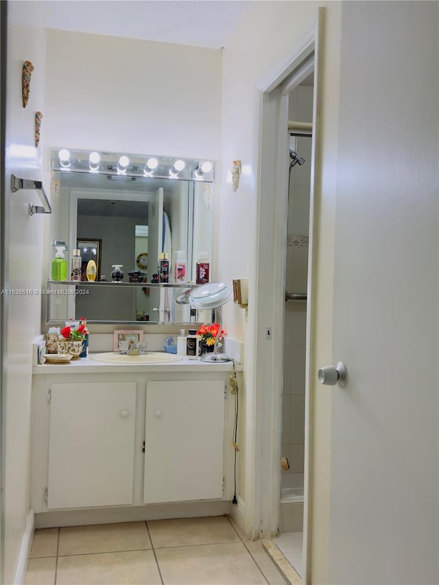 bathroom with vanity and tile patterned flooring