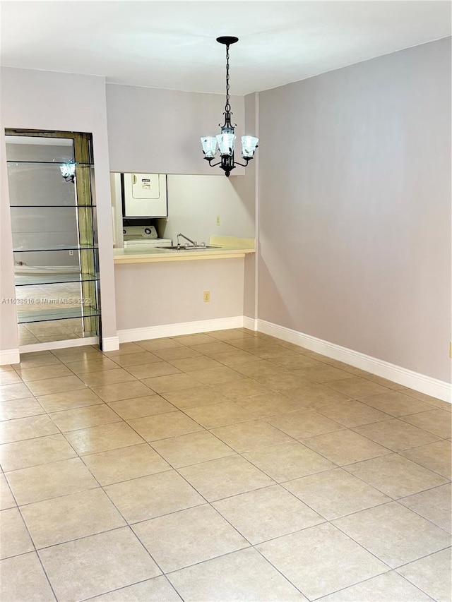 440 E 23rd St Unit 1219, Hialeah, FL 33013 - empty room featuring a chandelier, baseboards, and a sink