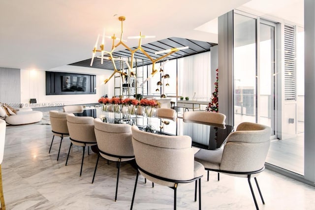 dining area featuring expansive windows and a chandelier