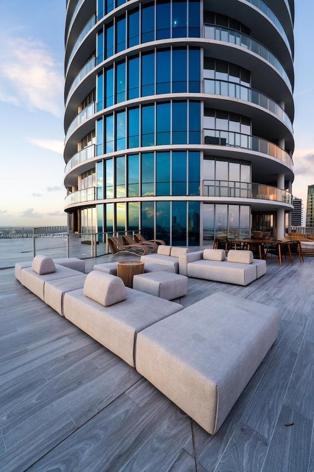 outdoor building at dusk featuring a water view