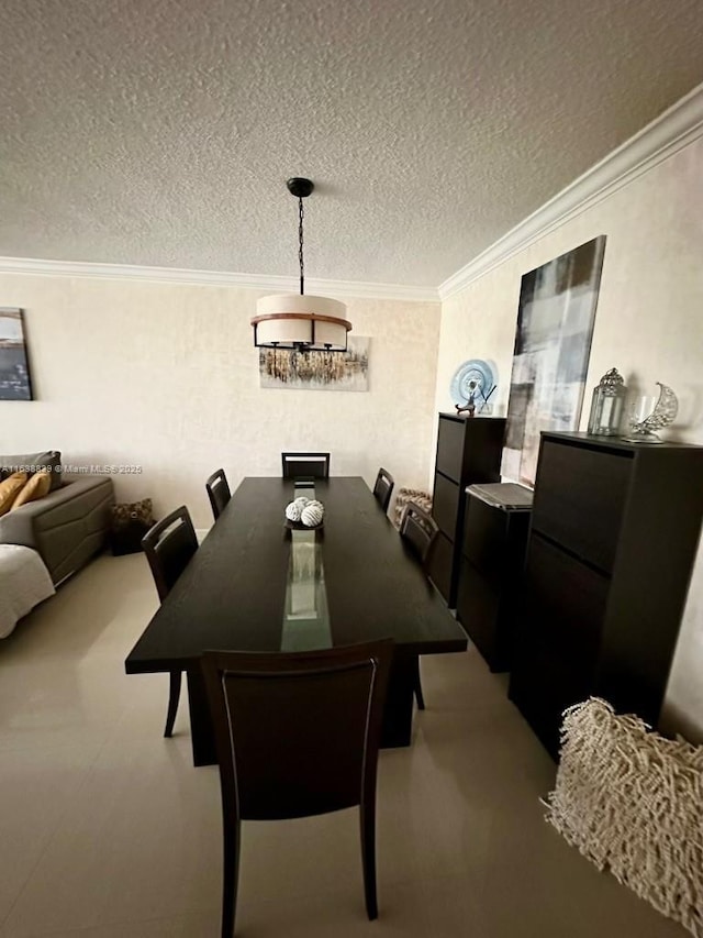 dining space featuring crown molding and a textured ceiling