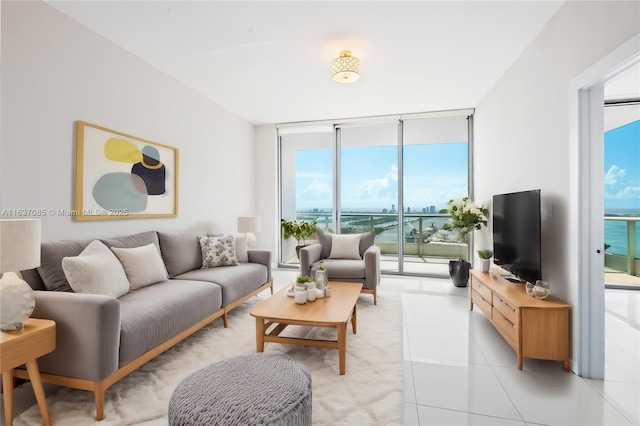 tiled living room featuring expansive windows