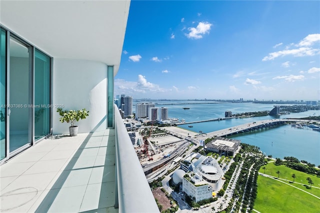 balcony featuring a water view