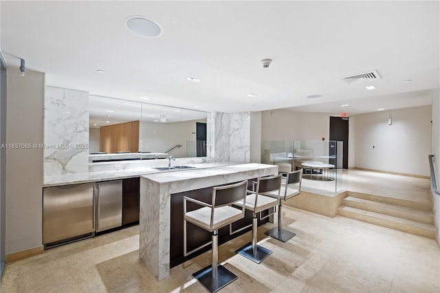 kitchen featuring sink and kitchen peninsula