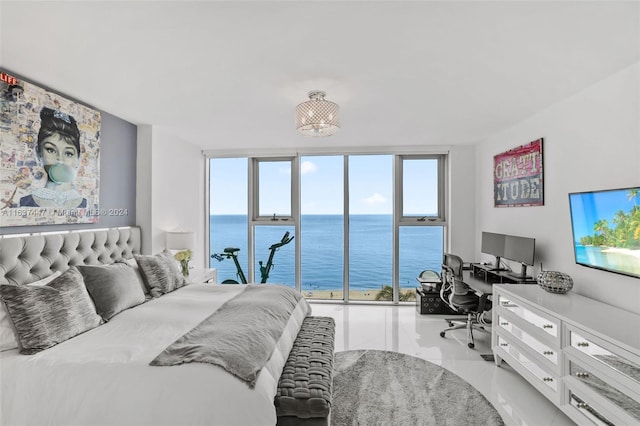 bedroom featuring floor to ceiling windows and tile patterned flooring